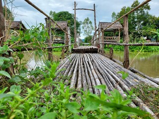 low angle wooden walkway overlooking the hut