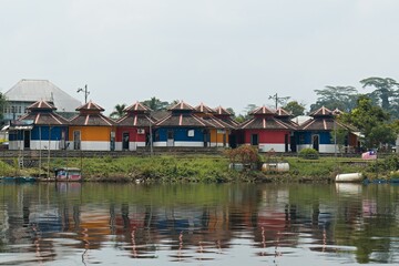 Fototapeta na wymiar View of Kuching city while cruising down the Sarawak River. Borneo island. Malaysia.