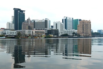 View of Kuching city while cruising down the Sarawak River. Borneo island. Malaysia.