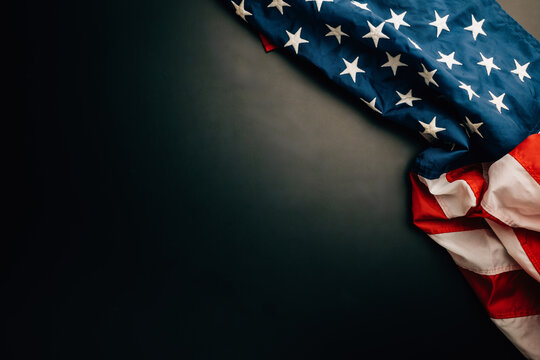Vintage Veterans Day American flags on a blackboard backdrop. A symbol of honor, democracy, and the United States is.
