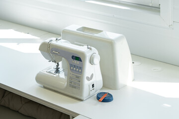 Sewing machine in textile factory close up