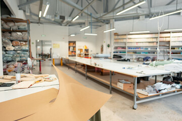 Interior of a sewing warehouse of furniture factory with equipment and materials