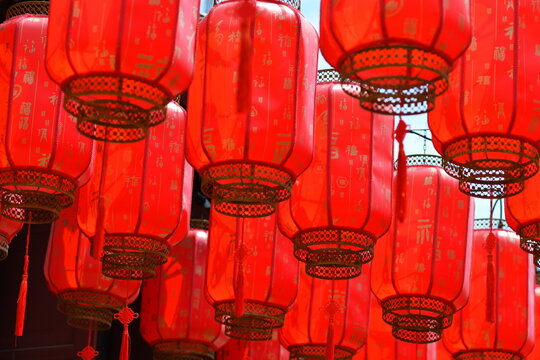 Photo of a traditional Chinese style red lantern. The Chinese word "Fu" on the lantern means blessing.