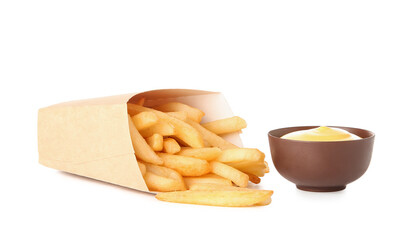 Paper box with tasty french fries and bowl of mayonnaise isolated on white background