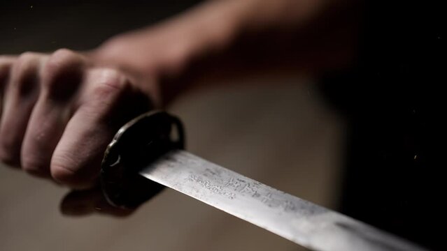 Close-up Of A Hand Holding A Japanese Sword