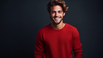 Obraz premium Strong smiling man in a red sweater on a dark background on the day of the Black Friday sale.