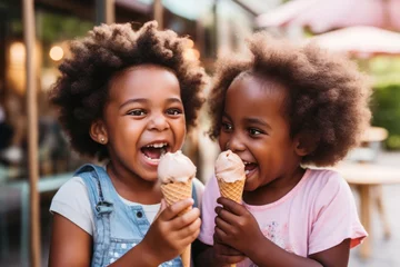Plexiglas foto achterwand African american little girls eating ice cream in cone at cafe © Anna