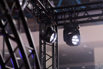 black metal stage truss with lighting fixtures - obrazy, fototapety, plakaty
