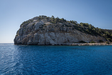 Fototapeta na wymiar Stunning Anthony Quinn Bay Beach and Rock Formations of Rhodes: A sea-level panoramic view of the island's diverse coastline, showcasing sandy retreats and towering cliffs, epitomizing Grecian beauty.