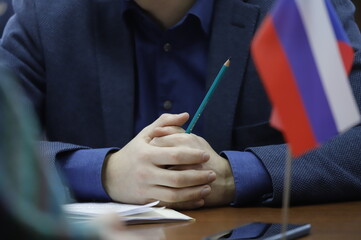 businessman writing on paper