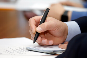 person signing a contract