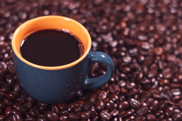 Fresh Black Coffee on Roasted Coffee Beans