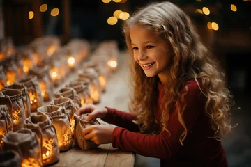 Gordijnen Happy cute girl searching for candy and gifts in advent calendar on during the winter Christmas holidays.Christmas gifts and traditions concept. © syhin_stas