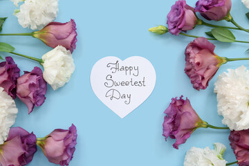 Card with text HAPPY SWEETEST DAY and roses on blue background