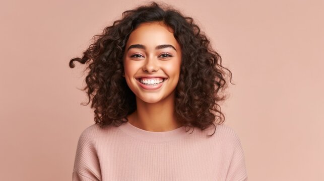 A teenage girl's genuine and infectious smile adds a touch of joy to this stock photo, perfect for various creative projects.