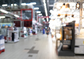 Abstract blurred background of modern luxury department store hall or shopping center mall. Blurred lights background. Blurred defocused bokeh lights with modern white interior architecture