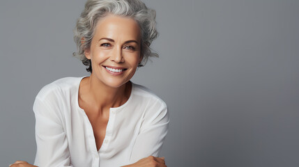 Portrait of a smiling woman with gray hair