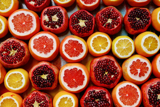 Fresh pomegranate and oranges at the Grand Bazaar, Istanbul. Flatlay view of orange, pomegranate, lemon, grapefruit filtered image