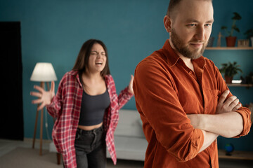 Angry wife shouts at upset husband, newlyweds quarrel over jealousy, relationship and divorce