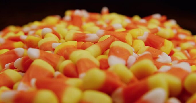 Candy corn slow flyover dolly on table shallow depth