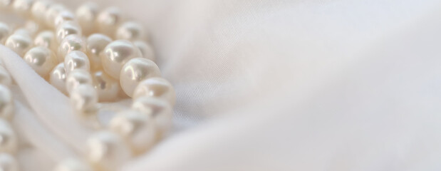 The soft glow of pearls on a white cloth paints a picture of gentle elegance. It's a nostalgic...