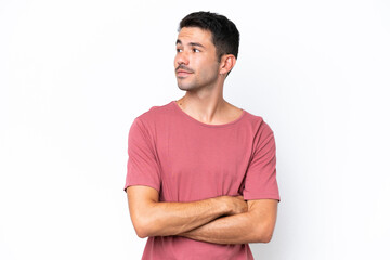 Obraz premium Young handsome man over isolated white background looking to the side