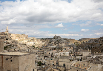 Obraz premium View of the Sassi di Matera a historic district in the city of Matera, well-known for their ancient cave dwellings. Basilicata. Italy