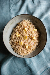 Butter rice, simple comfort japanese dish consisting in a portion of steamed rice with butter and a pinch of soy sauce
