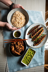 Japanese homemade food: butter rice, miso eggplants, karaage, fried edamame