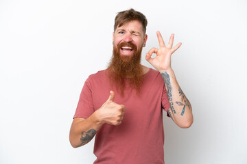 Redhead man with long beard isolated on white background showing ok sign and thumb up gesture