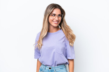 Young Uruguayan woman isolated on white background looking side