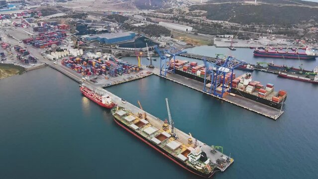 Commercial cargo bulk terminal with cargo vessels of industrial port international trade and logistic. Aerial view