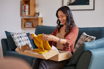Hispanic woman opening parcel package from online shop