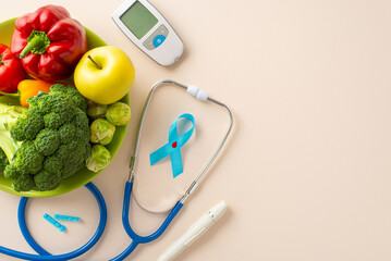 Diabetes Diet Essentials: Overhead shot displaying a blue ribbon, glucose meter, lancet pen,...