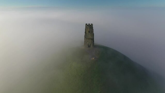 Aerial of Glastonbury Tor on a misty winter morning, Glastonbury, Somerset, England