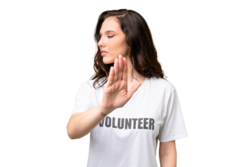 Young volunteer caucasian woman over isolated background making stop gesture and disappointed