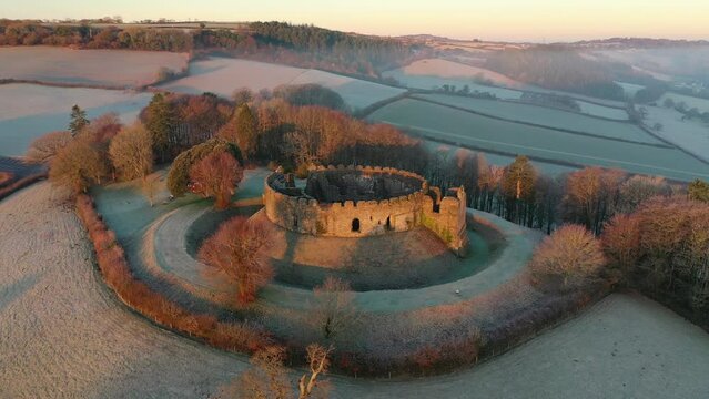 Aerial of Restormel Castle at dawn on a frosty winter morning, Cornwall, England