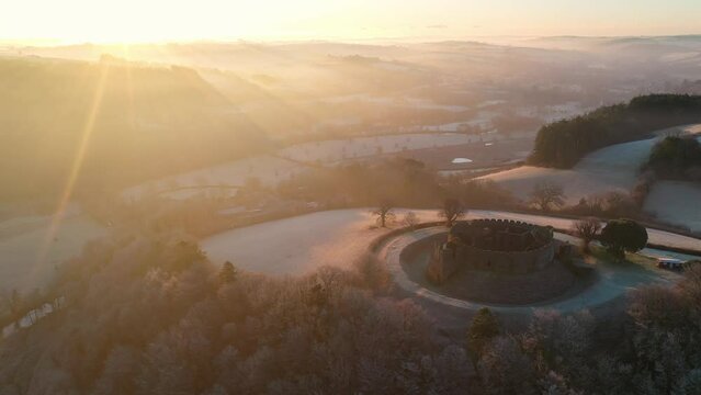 Aerial of Restormel Castle at dawn on a frosty winter morning, Cornwall, England