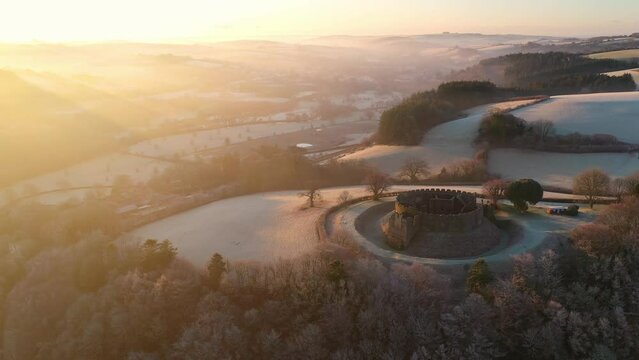Aerial of Restormel Castle at dawn on a frosty winter morning, Cornwall, England
