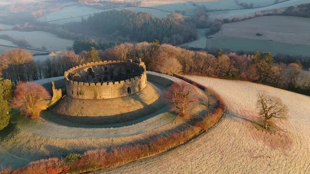 Aerial of Restormel Castle at dawn on a frosty winter morning, Cornwall, England