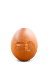 Broken raw brown egg isolated on white background.