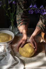 Woman  working with homemade yeast dough.