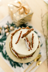 Christmas cake with gifts and balls around, Christmas celebration, kitchen, happy new year