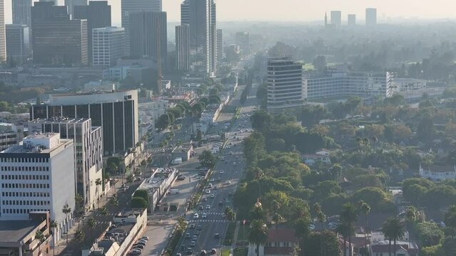 LA, California, USA - light hazy Aerial video view with slow right pan from West Los Angeles (Westfield Century City) along Santa Monica Blvd to Westwood area - video footage