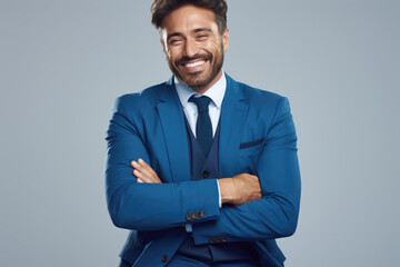 Picture of man in blue suit and tie, with smile on his face. Suitable for professional and business-related themes.