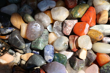Colored smooth pebbles on the beach