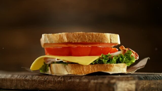 Super slow motion of stacking sandwich pieces. Camera in motion. Filmed on high speed cinema camera, 1000 fps. Placed on high speed cine bot.