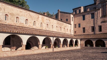 Fototapeta na wymiar View of the cloister of ancient abbey in the Marche region, Italy