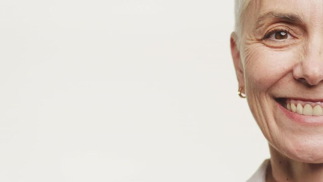 Half Face Portrait of Senior Woman Smiling on