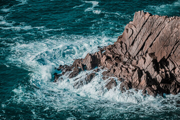 Waves on rugged rocks by the sea